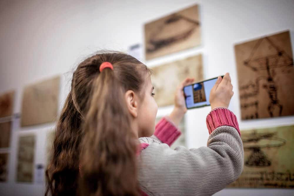 Young girl playing game on smartphone